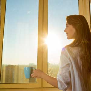 Woman Opening Curtains Woman Opening Curtains